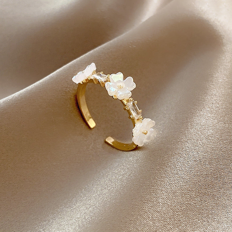 THREE SMALL FLOWERS OPEN RINGS